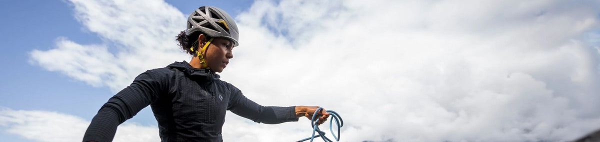 Person wearing a grey climbing helmet