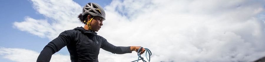 Person wearing a grey climbing helmet