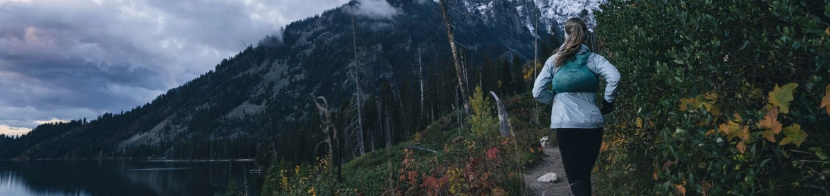 Woman hiking on a mountain trial