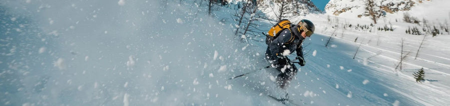 Person skiing down a trail